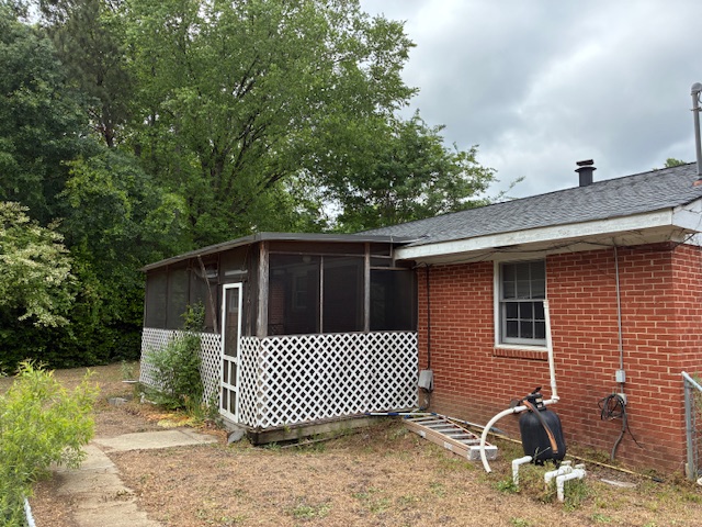 Side yard and screened porch